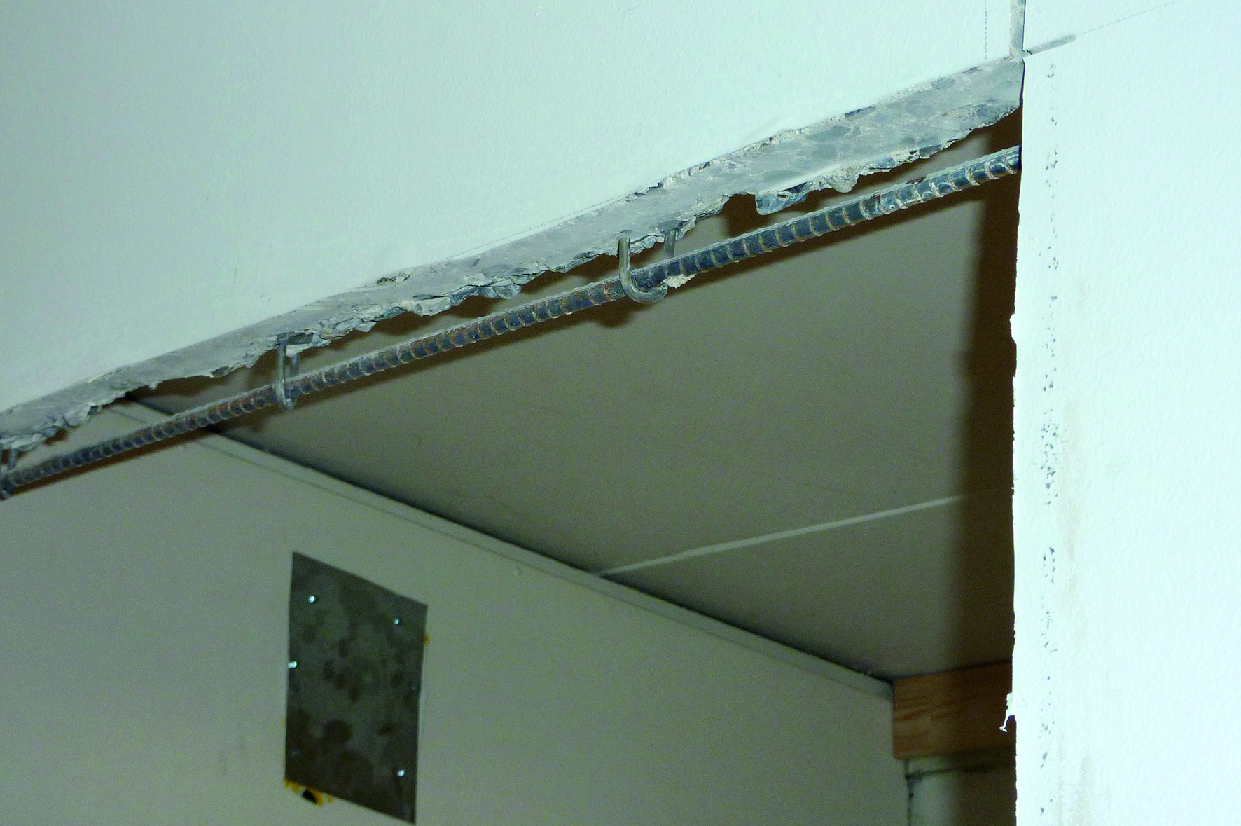  Concrete adjacent to door joint has been removed.