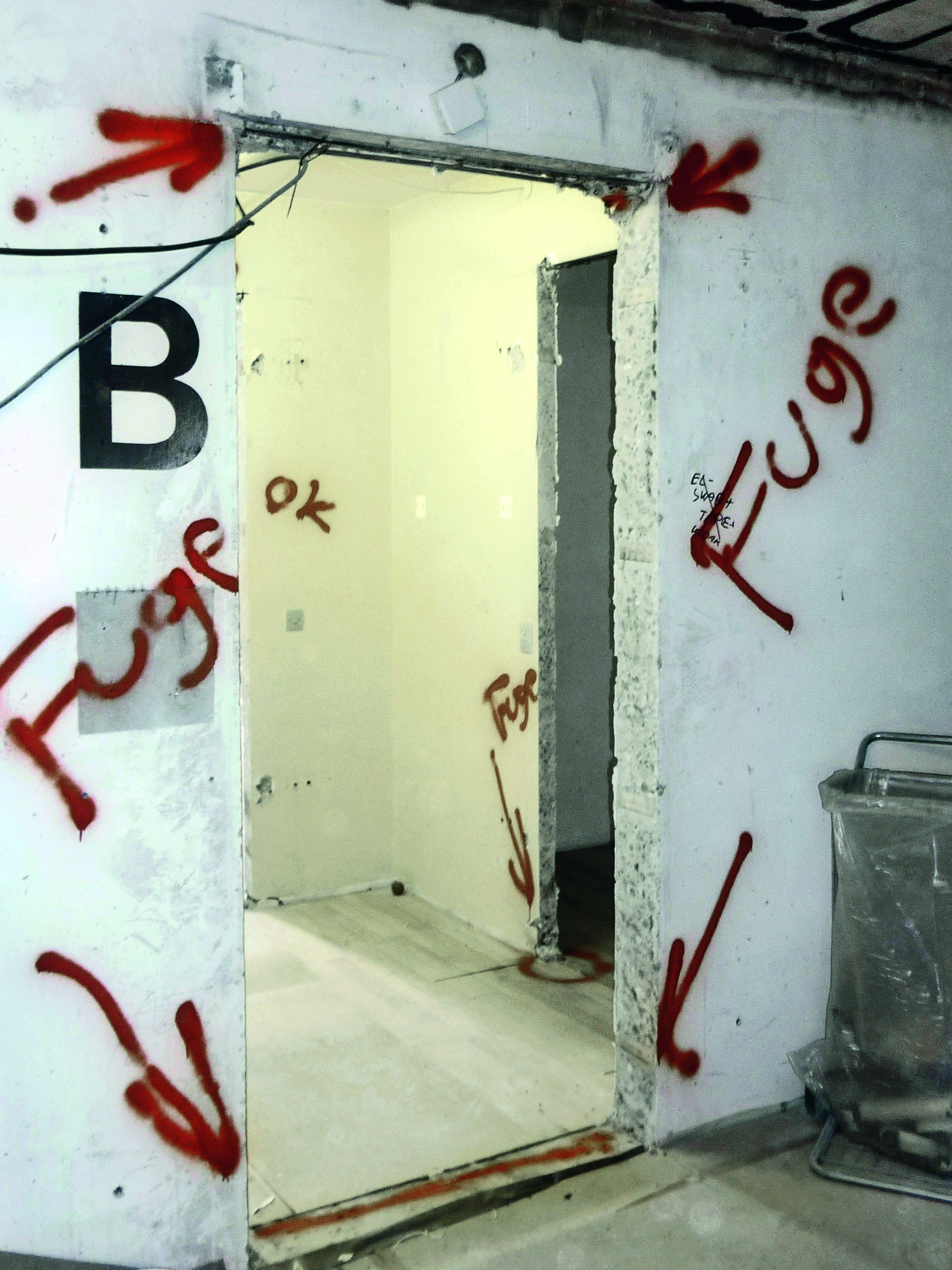 Example in which locations with caulk containing PCBs are marked.